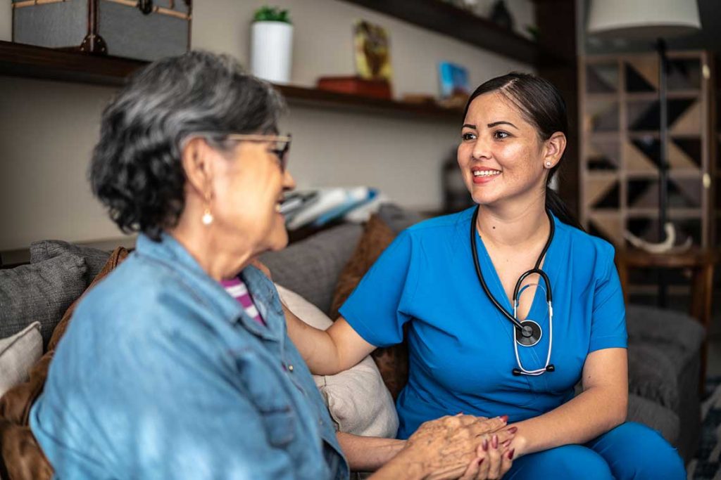 nurse sitting with patient