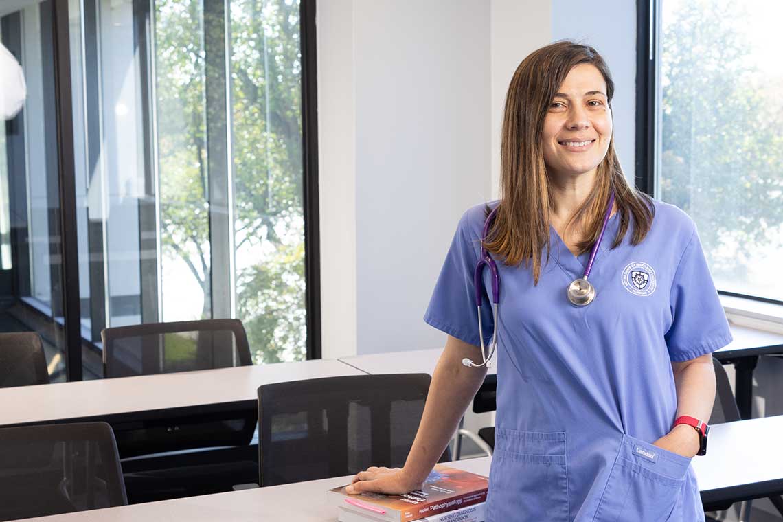 NDMU nursing student standing in classroom