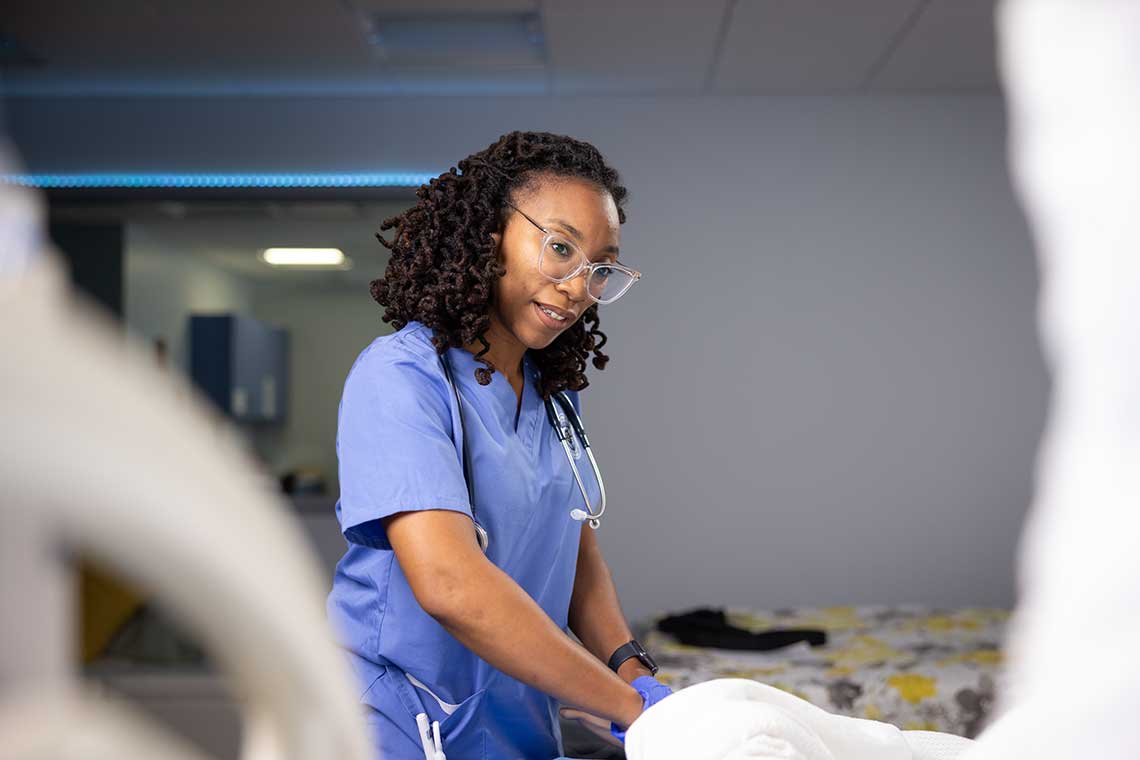 nursing student in sim lab