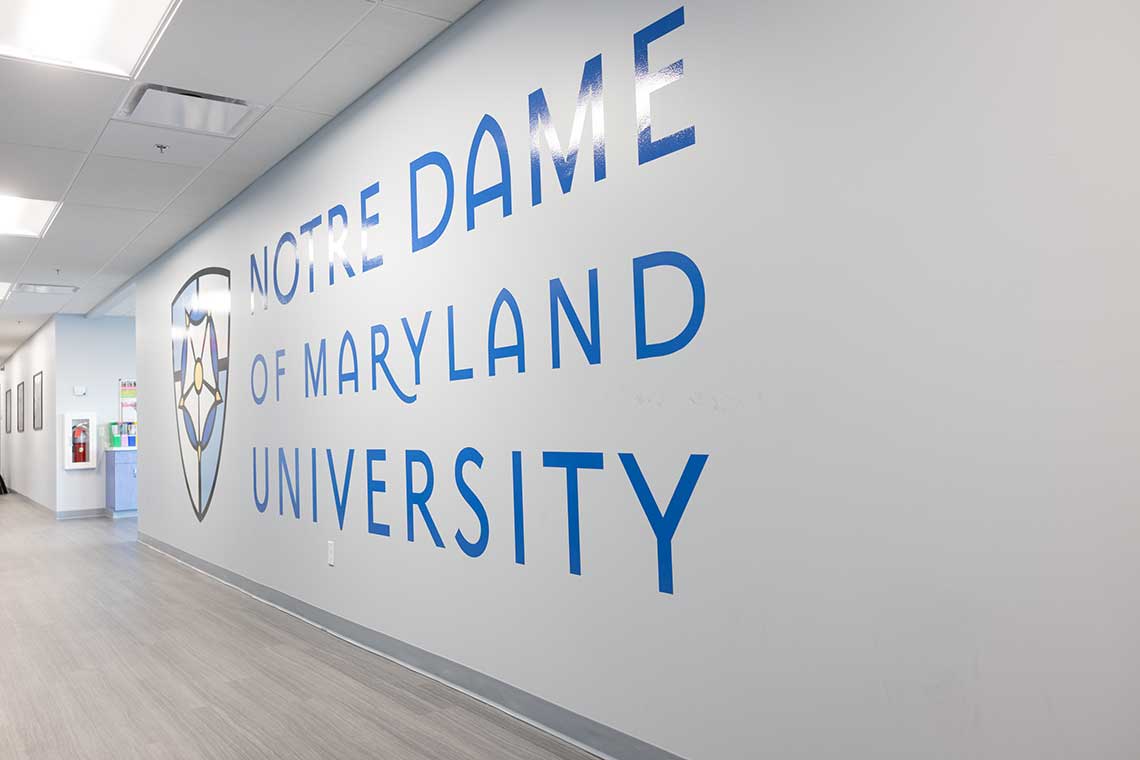 NDMU logo on wall in hallway